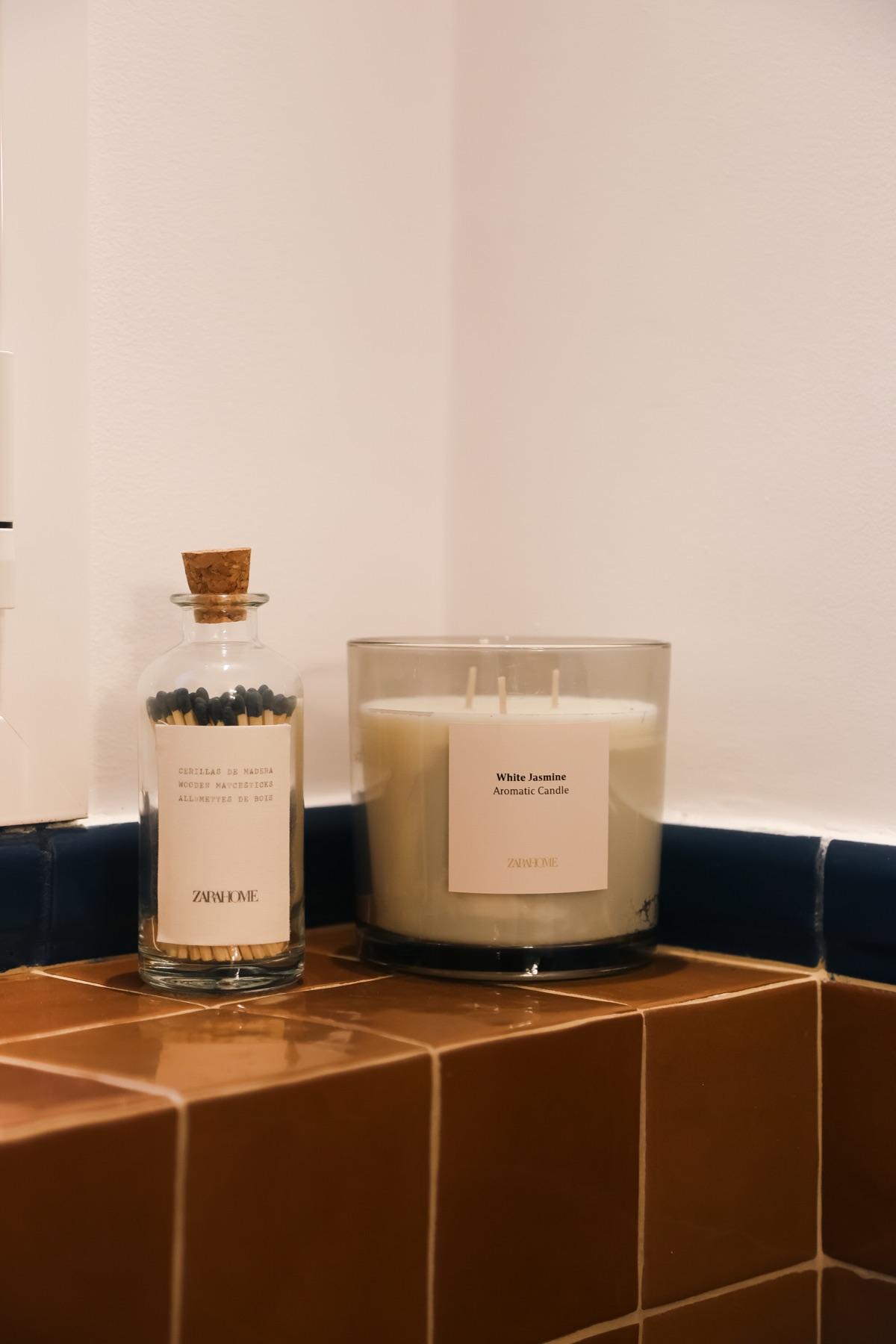Candle and matches on terracotta tiles